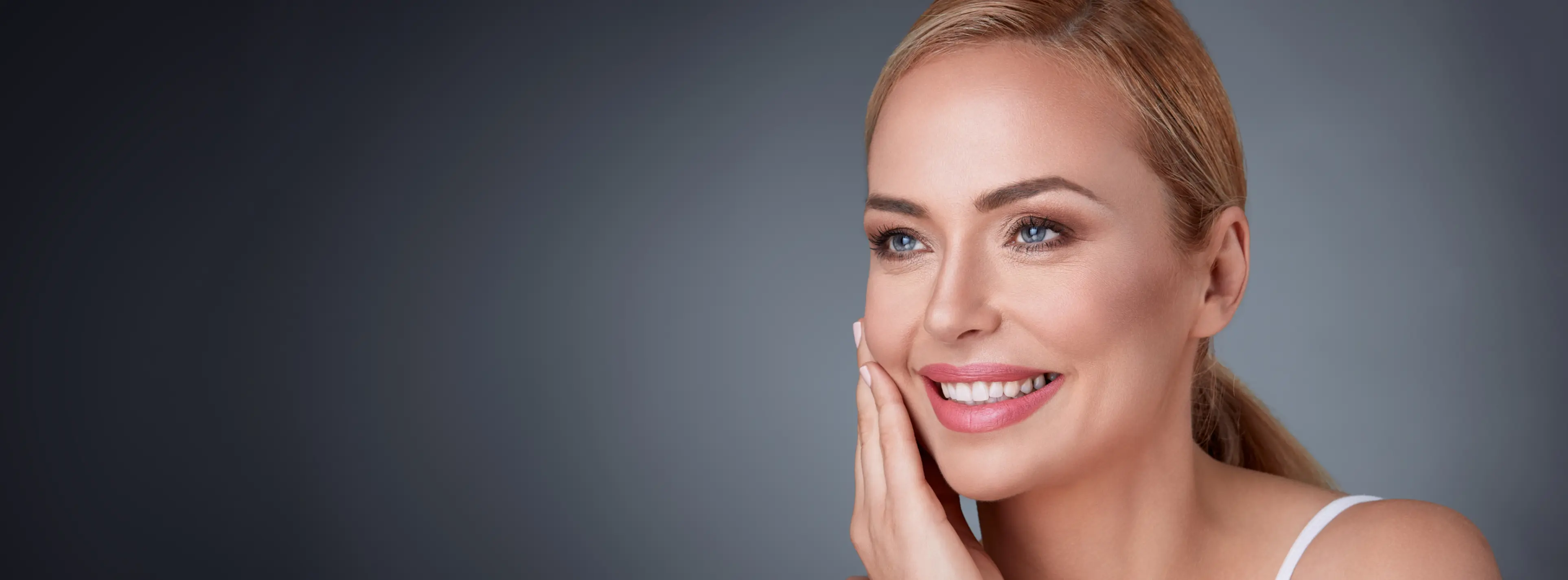 Middle Aged Woman Touching Her Face